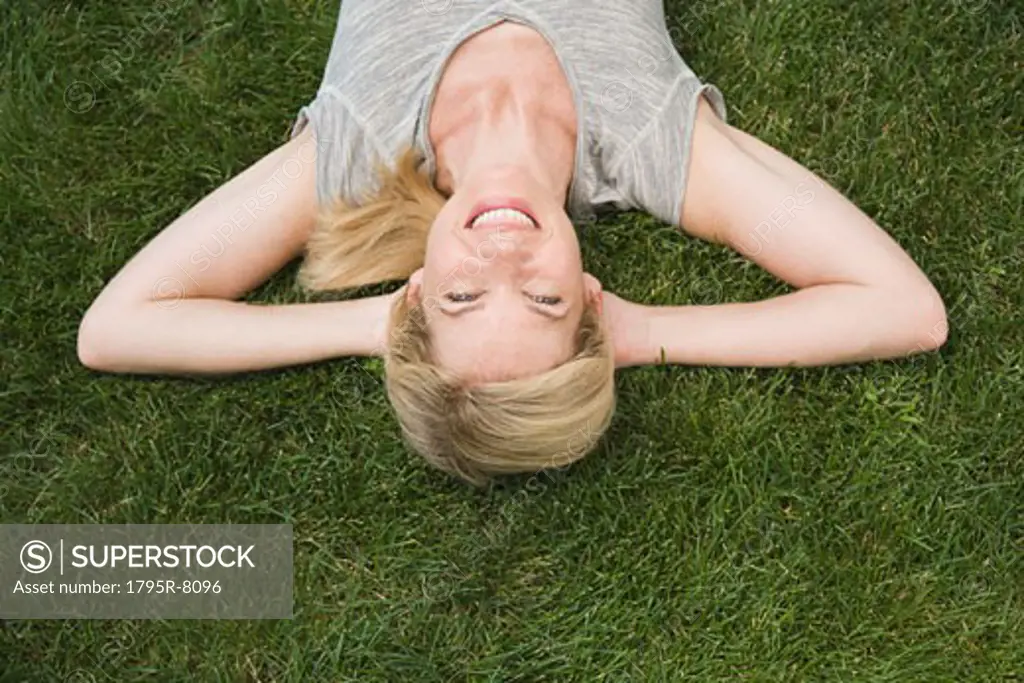 Woman laying in grass