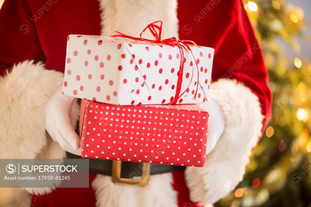 Santa claus holding presents