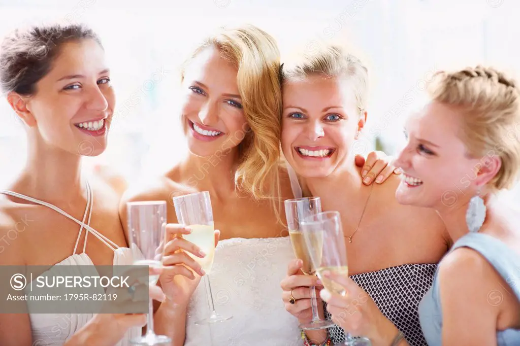 Bride and bridesmaids toasting