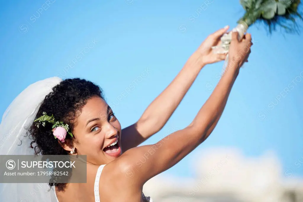 Bride throwing bouquet