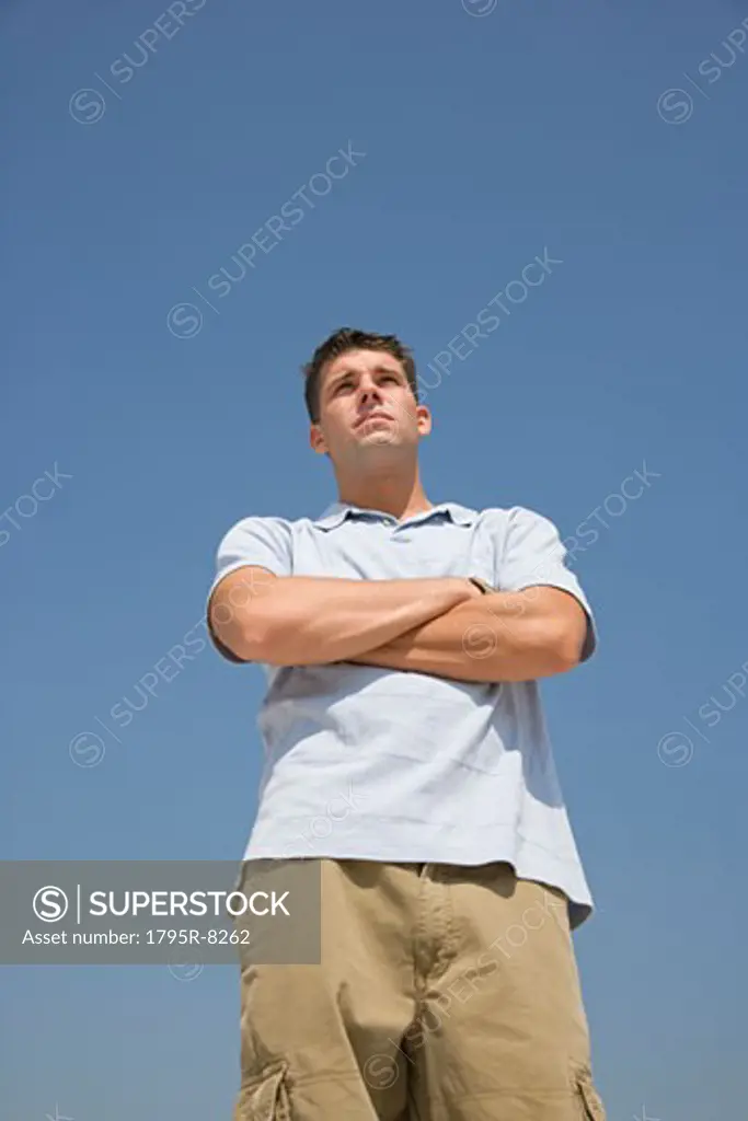 Young man with arms crossed