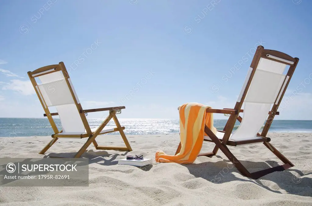 Sun chairs on sandy beach
