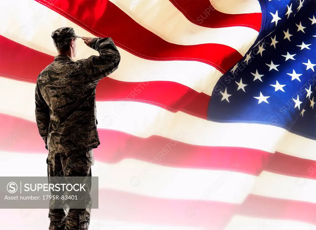 Army soldier saluting in front of American flag
