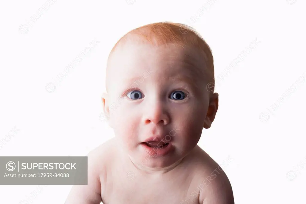Studio shot portrait of surprised baby boy (18-23 months)