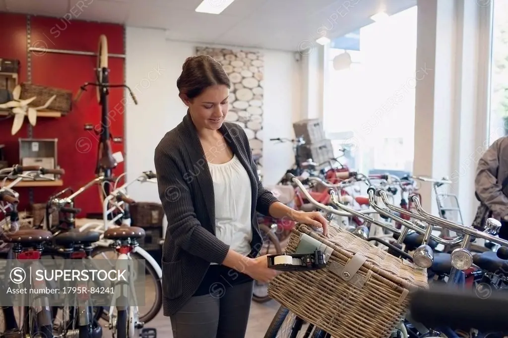 Business owner pricing bike basket in store