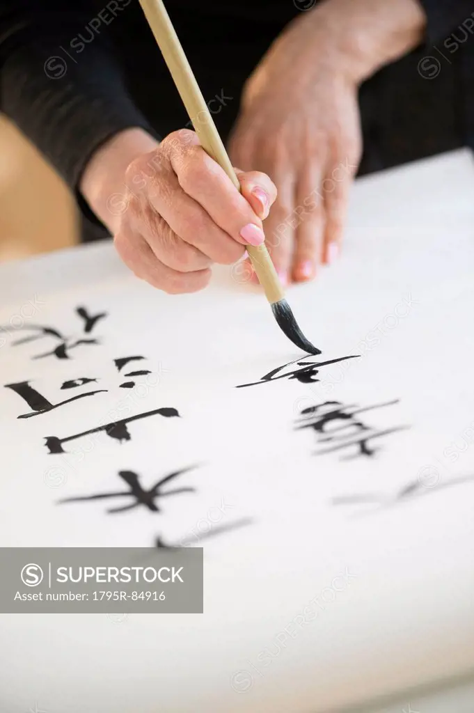 Female hands and japanese calligraphy