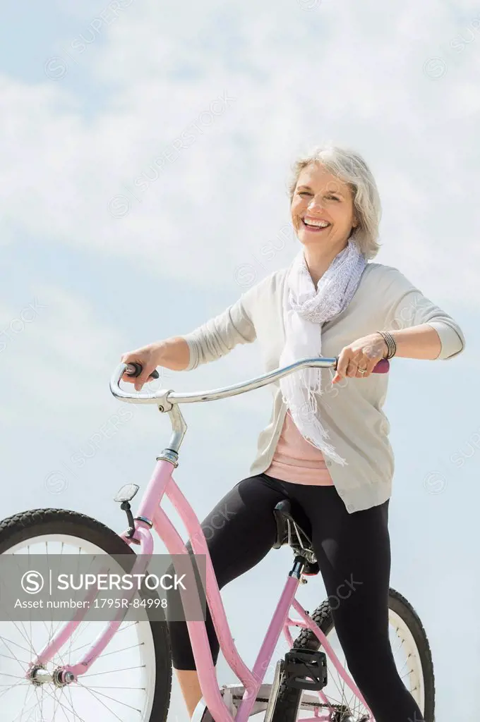 Senior woman riding bicycle