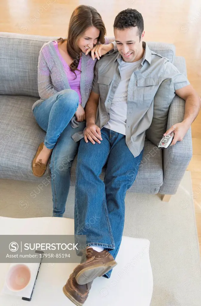 Young couple relaxing on sofa