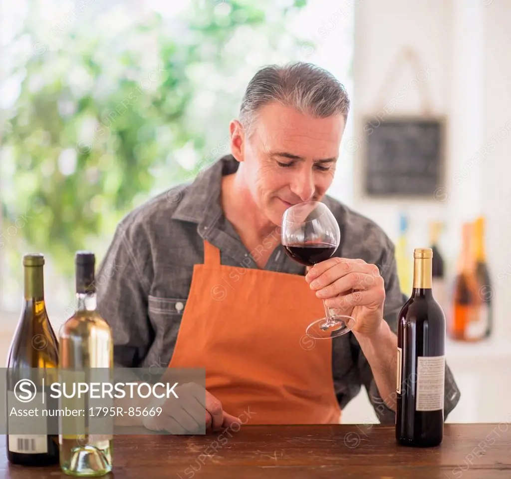 Portrait of man tasting wine