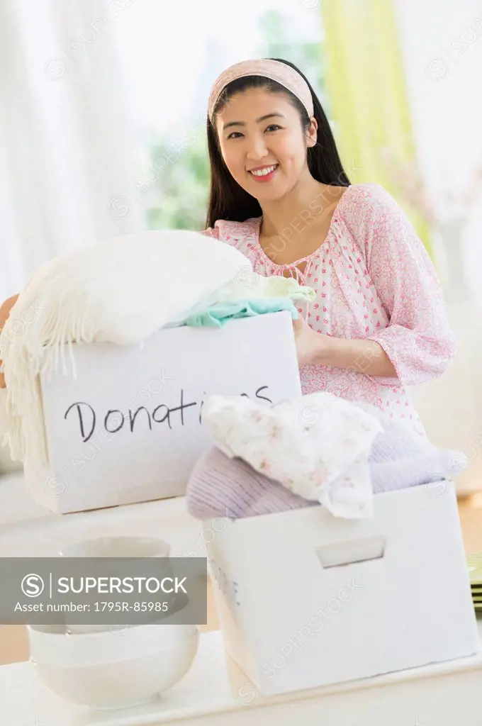 Woman donating household items