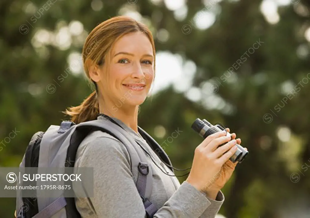 Woman holding binoculars