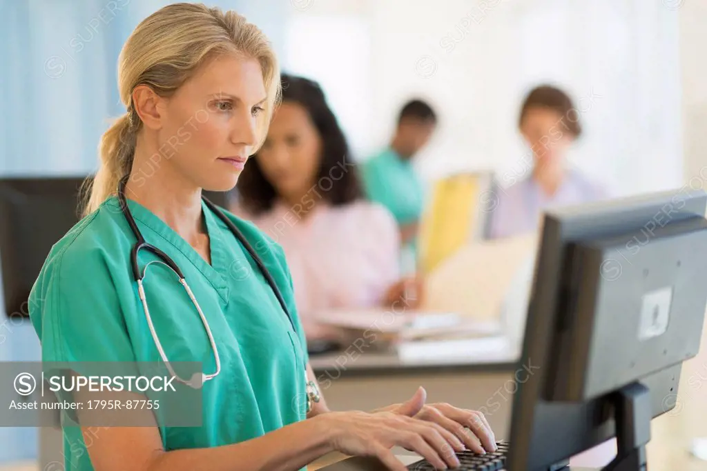 Doctor working at desks in hospital