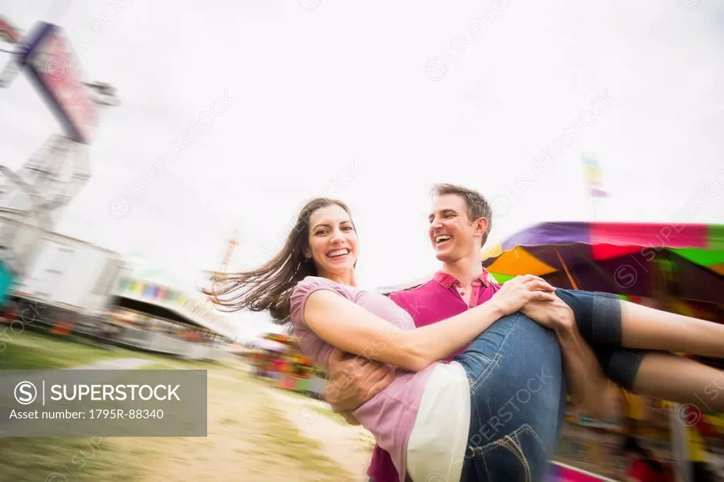 Couple in amusement park