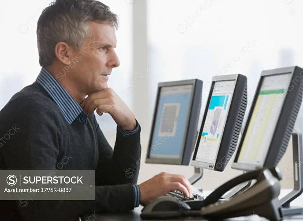 Businessman typing on computer