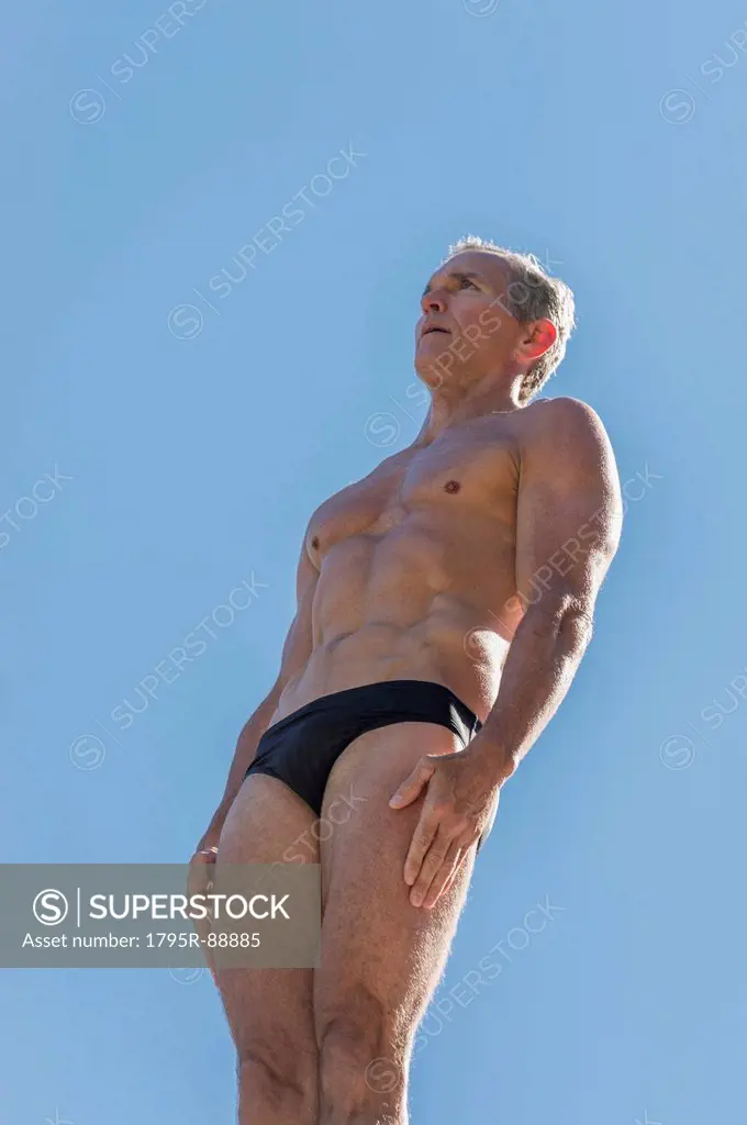 Athletic swimmer against blue sky