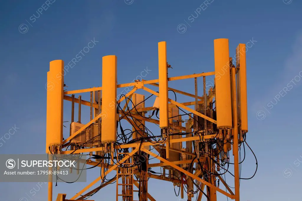 Mobile phone tower on evening sky