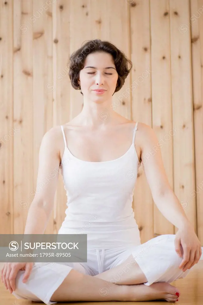 Woman meditating in spa