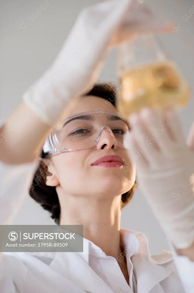 Scientist examining liquid