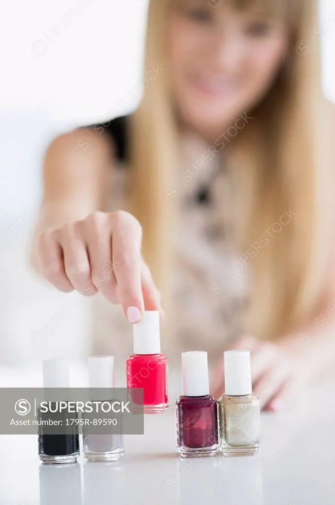 Woman choosing nail polish