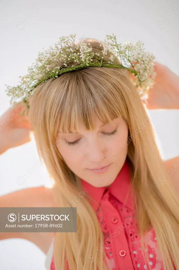 Portrait of woman wearing flower wreath