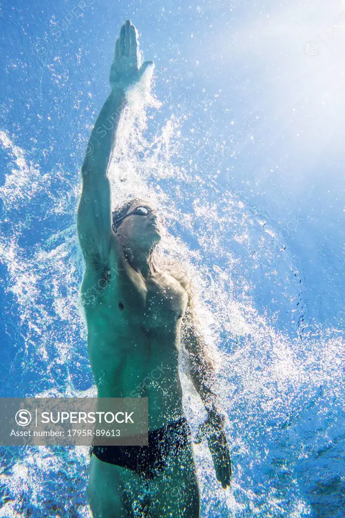 Underwater view of athletic swimmer