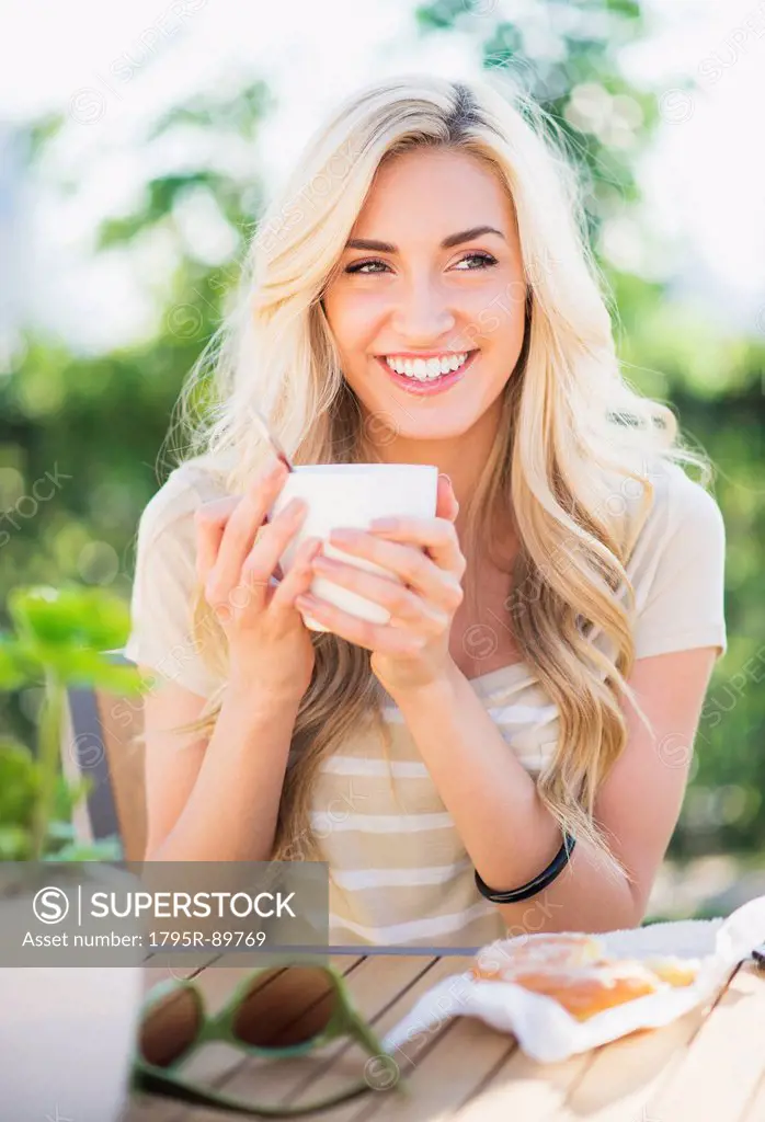Portrait of teenage girl (16-17) drinking coffee
