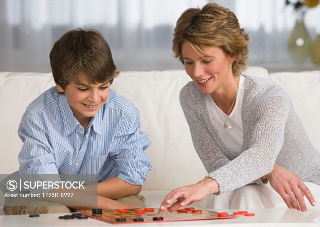 Mother and son playing checkers