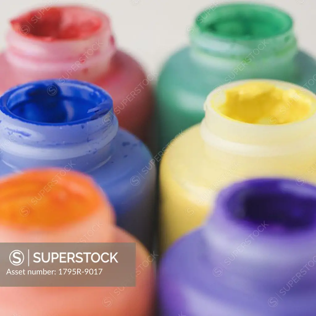 Closeup of open paint bottles