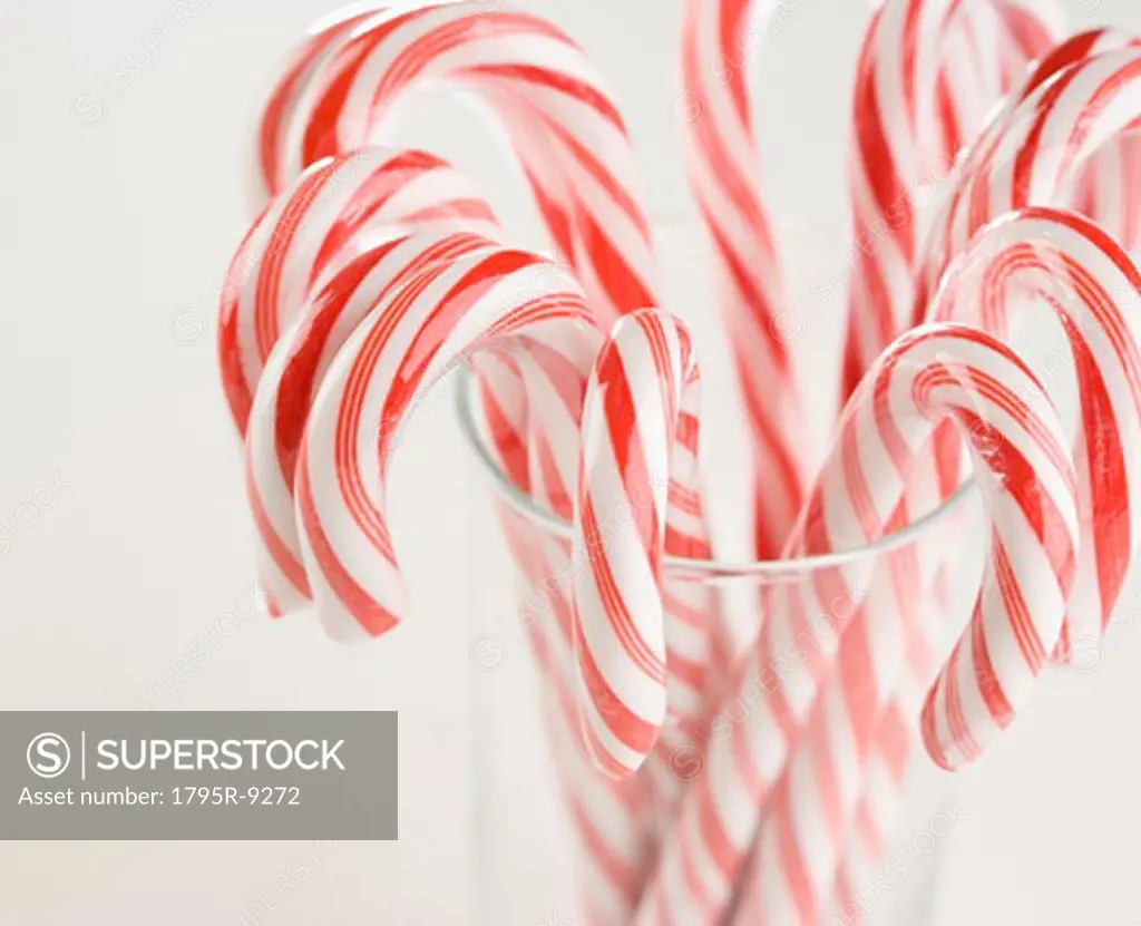 Close-up of candy canes in a glass