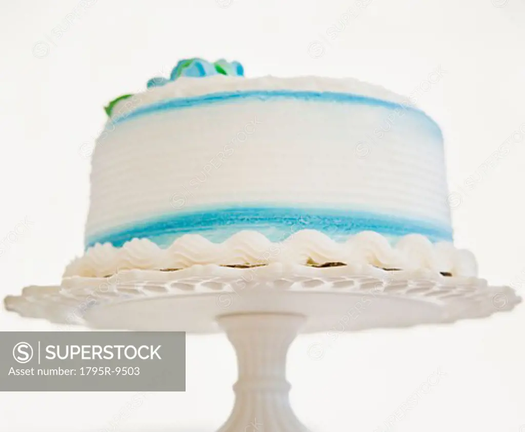 Decorated cake on pedestal