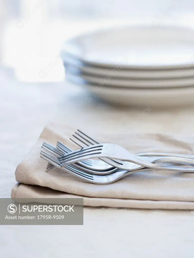 Close-up of forks on napkin