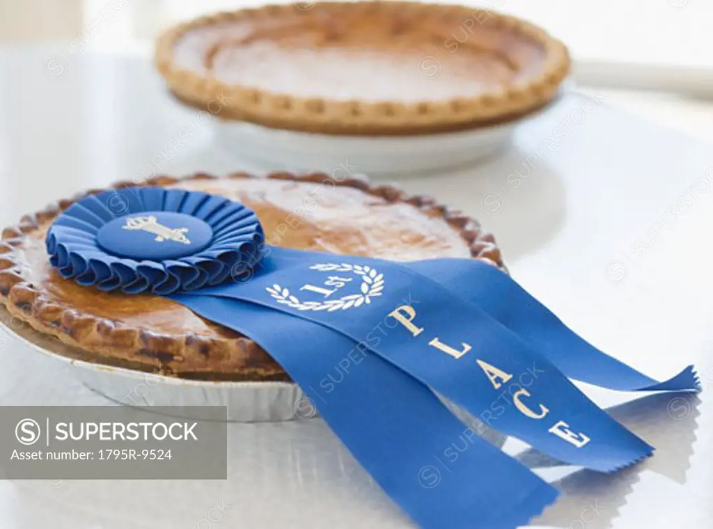Close-up of blue ribbon on pie