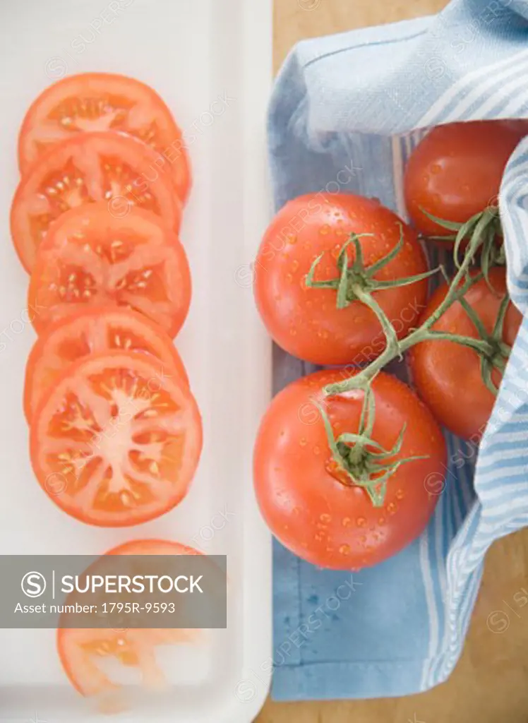 Sliced tomatoes on cutting board