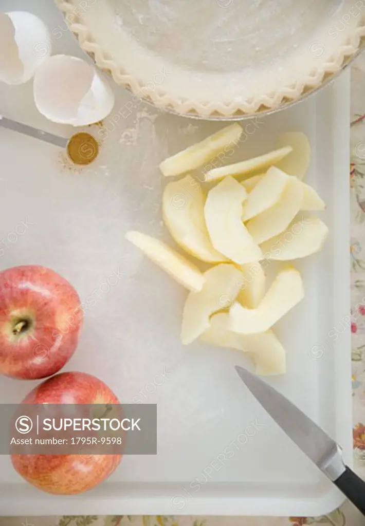 High angle view of slice apples and pie crust