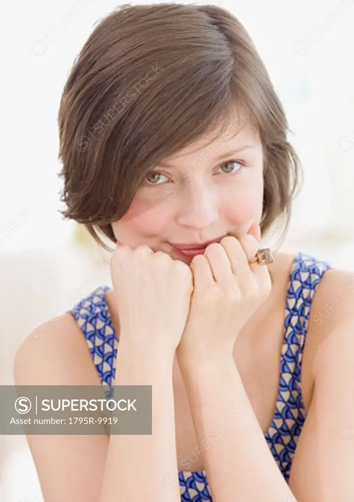 Woman leaning chin on hands