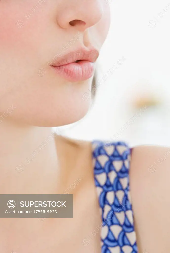 Close-up of woman whistling