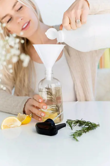 Woman making a homemade natural cleaner