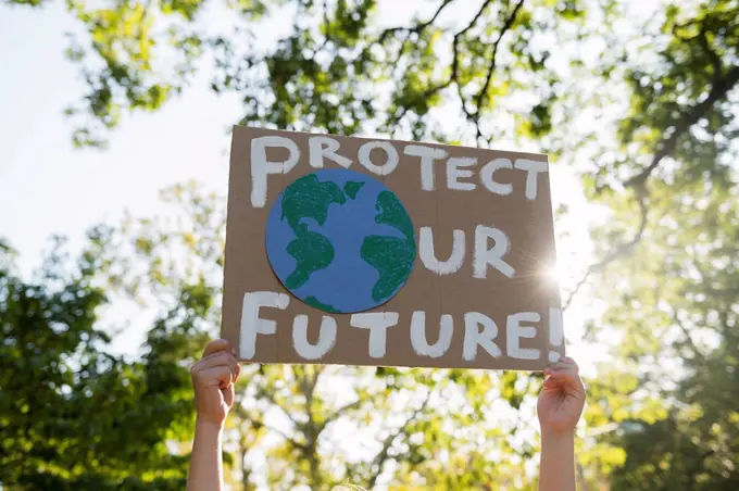 Climate change activist holding sign