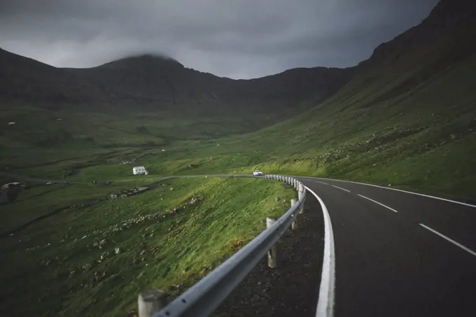 Denmark, Faroe Islands, Vagar, Sorvagur, Road through green landscape