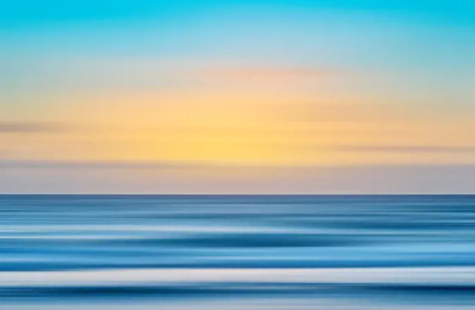Calm sea surface at sunset