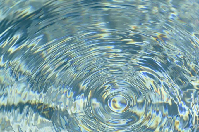 Concentric ripples on water surface