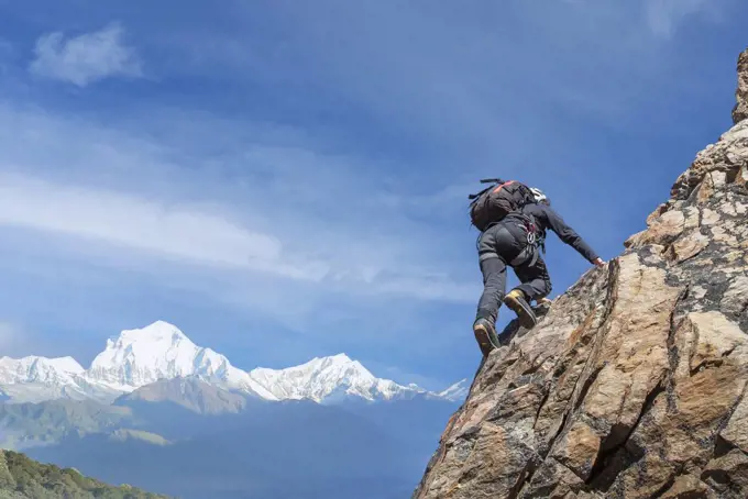France, Haute Savoie, Chamonix, Mont Blanc, Man climbing rocky wall of Mont Blanc