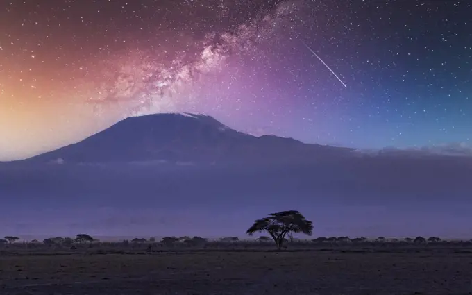 Africa, Kenya, Milky way and falling star over Mount Kilimanjaro in Amboseli National Park