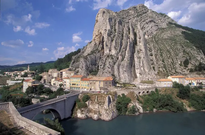 France, Provence, Sisteron, Rocher de la Baume mountain with village near Durance river