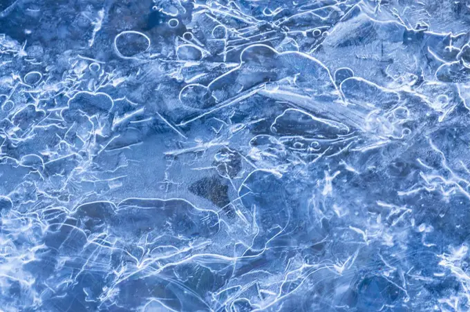 Clear blue ice in river