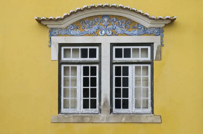 Portugal, Santarem, Yellow building with traditional tile work
