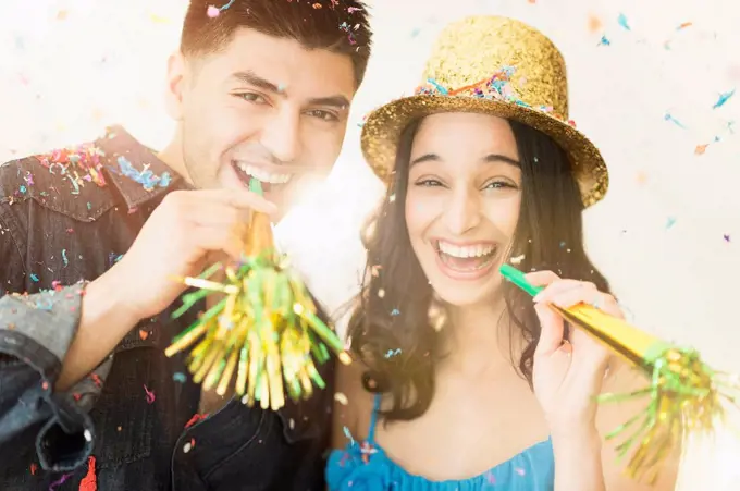 Young couple celebrating New Year's Eve