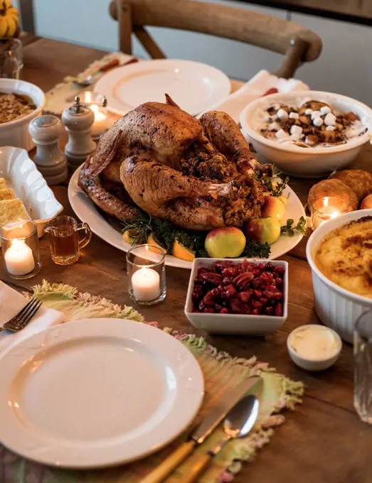 Dining table filled with thanksgiving food