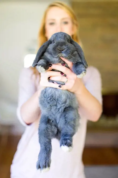 Portrait of young woman and her bunny