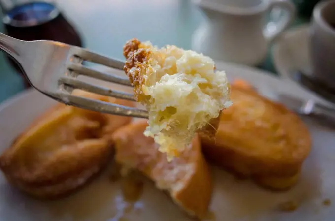 Piece of french toast on fork